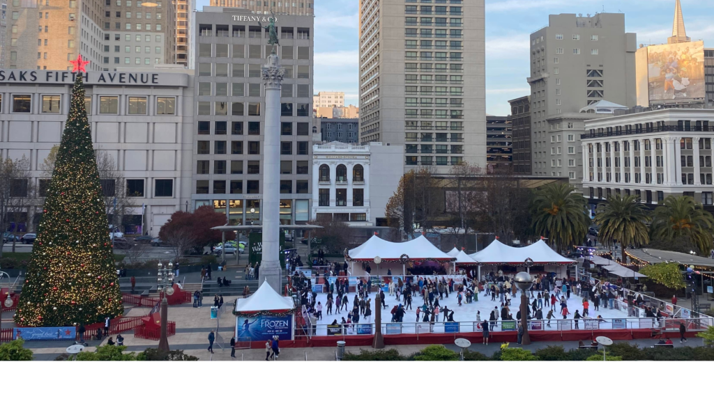 a view of an ice rink and christmas tree during christmas time in sf