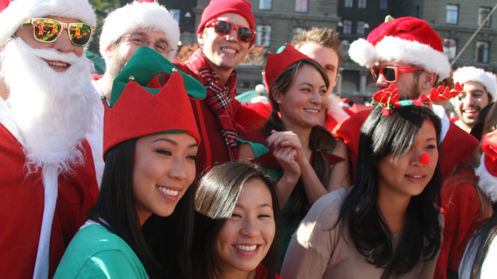 group of people dressed up in santa costumes for santacon in san francisco